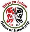 A circular logo with two stylized animals in black and red facing each other, surrounded by the words, "Hiiye'yu Lelum House of Friendship"